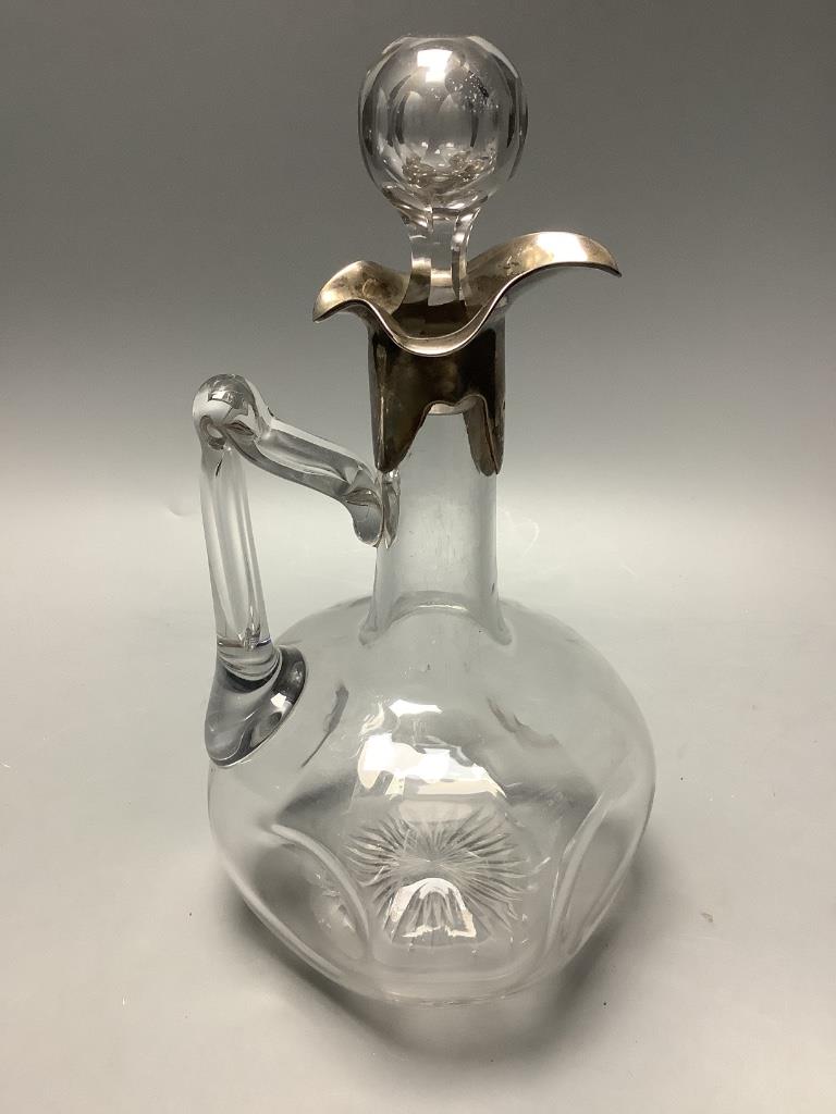 An Edwardian silver mounted glass claret jug with glass stopper, by Horton and Allday, Birmingham 1906, overall height 24.9 cm.